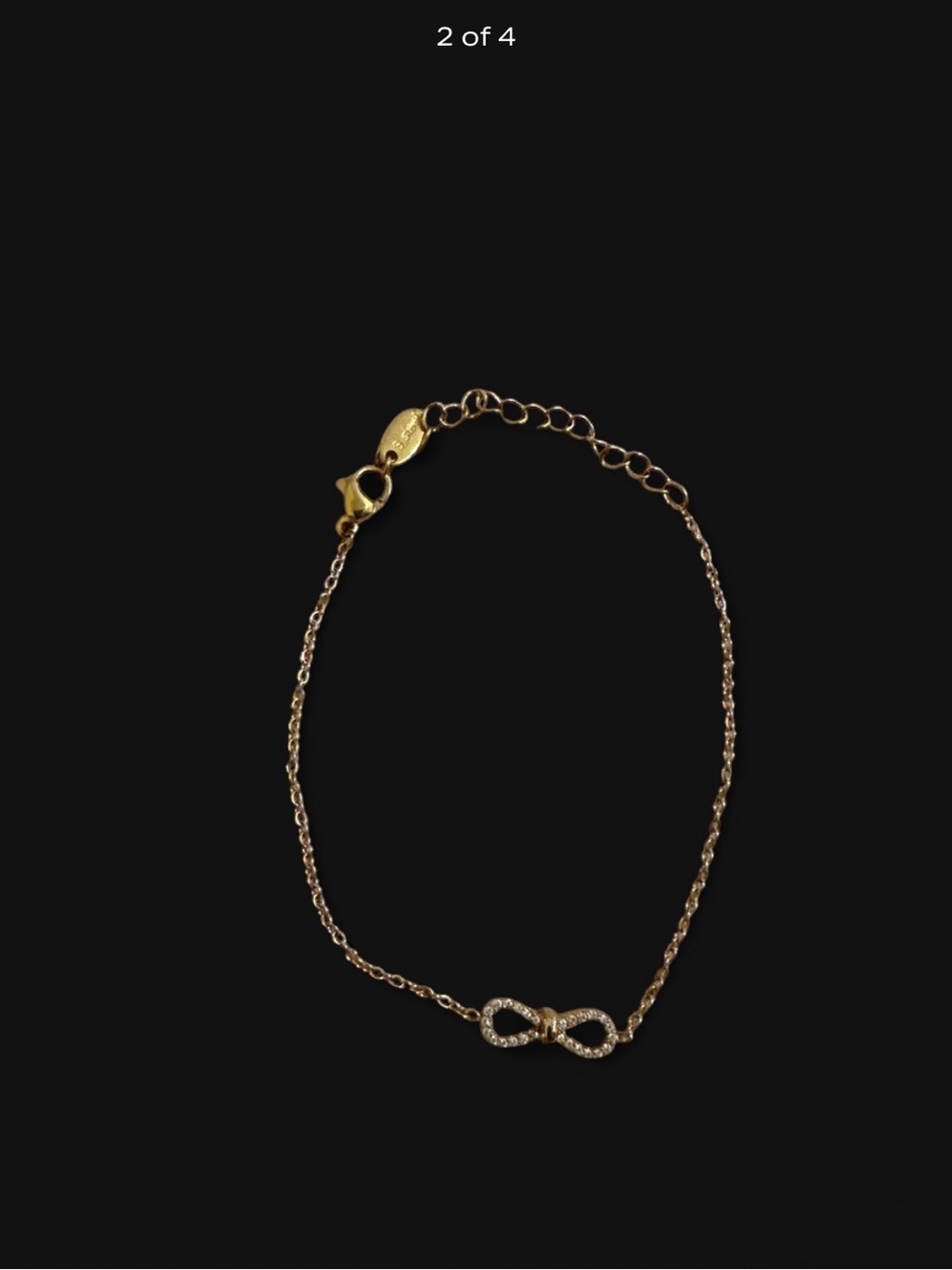 Stainless Steel Gold Infinity Bracelet With Rhinestones.